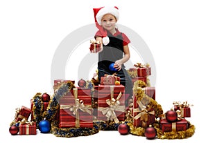 Cute little girl in a Santa Claus cap with Christmas gifts, isolated