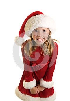 A Cute Little Girl in A Santa Claus Hat and Christmas Dress