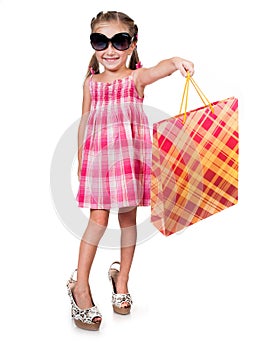 Cute little girl with shopping bag