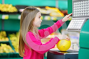 Cute little girl shopping in a food store