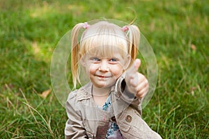 Cute little girl show thumb up