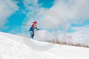 Cute little girl ski in winter nature, kids seasonal sport