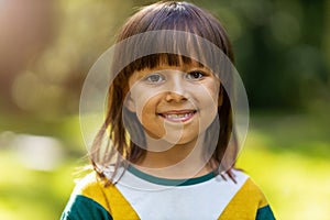 Cute little girl smiling outdoors