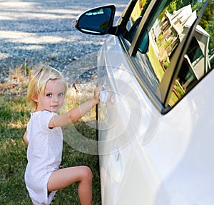 Cute Little girl standing by the car. Wanaka, New Zealand