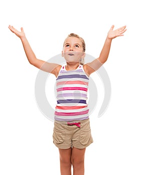 Cute little girl standing on white stretching her arms up