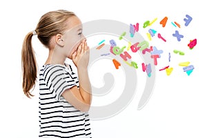 Cute little girl in stripped T-shirt shouting out alphabet letters. Speech therapy concept over white background.