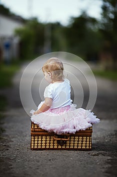 Cute little girl with suitcase