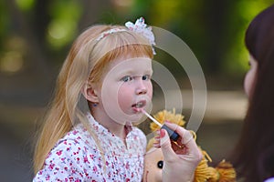 Cute Little girl in the summer park