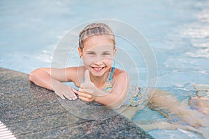 Cute little girl in swimming pool