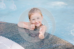 Cute little girl in swimming pool