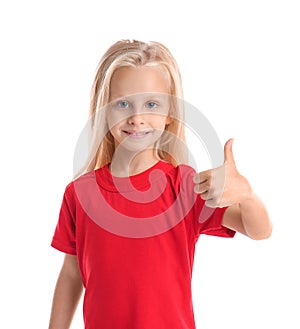 Cute little girl in t-shirt showing thumb-up on white background