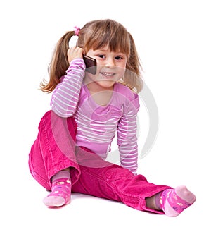 Cute little girl is talking on cell phone