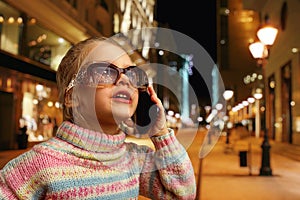 Cute little girl talks on phone