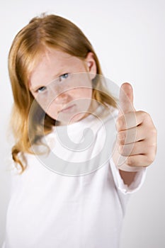 Cute little girl with thumb up