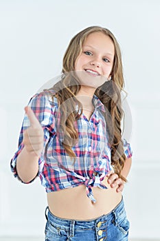 Cute little girl with thumb up