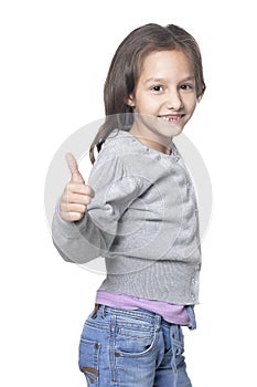 Cute little girl with thumb up isolated on white background
