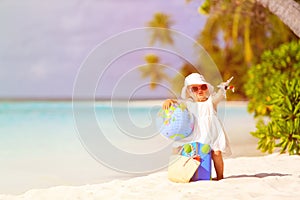 Cute little girl travel on summer beach