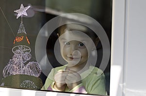 A cute little girl waiting for the Christmas