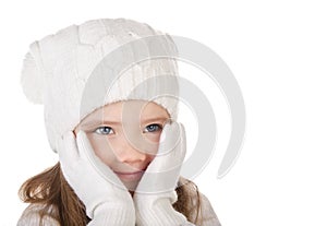 Cute little girl in warm hat and gloves closing her cheks isolated