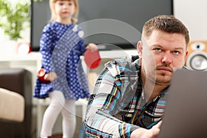 Cute little girl watch out furtively for her dad