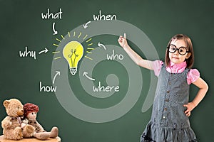 Cute little girl wearing business dress and analyzing problem and find solution, on green chalk board.