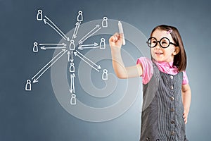 Cute little girl wearing business dress and drawing social network structure. Blue background.