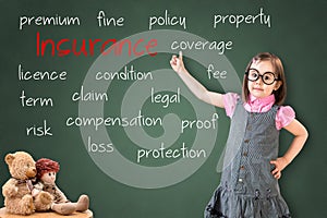 Cute little girl wearing business dress and showing insurance concept on green chalk board.