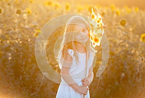 Cute little girl with a windmill