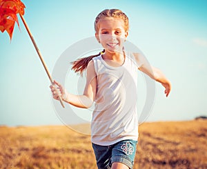 Cute little girl with a windmill