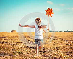 Cute little girl with a windmill