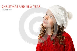 Cute little girl in winter clothes on isolated white background