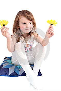 Cute little girl with yellow daisies isolated