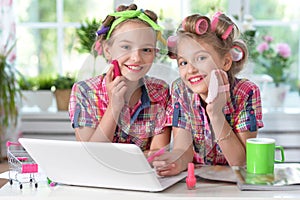 Cute little girls beautifying themselves