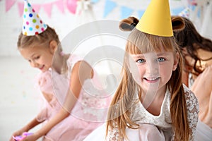 Cute little girls celebrating Birthday at home