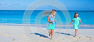 Cute little girls enjoying summer beach vacation