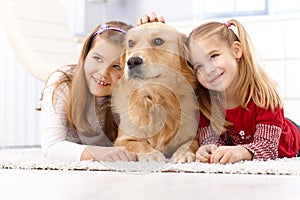 Cute little girls with pet dog smiling