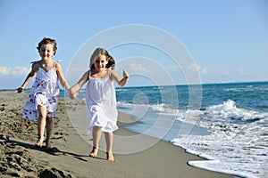 Cute little girls running on beach