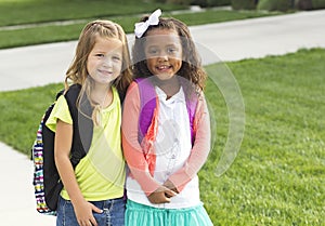 Cute Little girls walking to school together