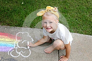 Cute Little Kid Coloring with Sidewalk Chalk Outside