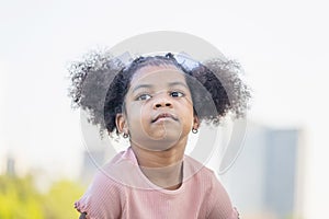 Cute little kid girl playing outdoors in the garden, Happy child girl in the park