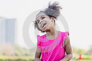 Cute little kid girl playing outdoors in the garden, Happy child girl in the park