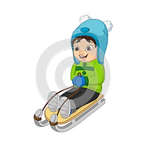 Cute little kid sledding down the hill