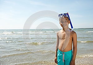 Cute little kid smiling with snorkel