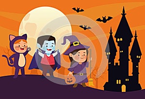 Cute little kids dressed as a cat and witch with dracula in castle scene