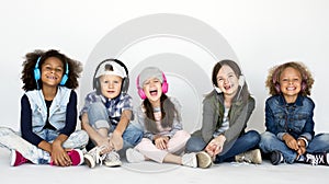 Cute Little Kids Sitting Listening to Music