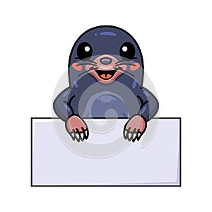 Cute little mole cartoon with blank sign