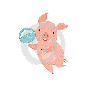 Cute little pig playing with ball, funny piglet cartoon character having fun vector Illustration on a white background