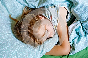 Cute Little Preschool Girl Sleeping In Bed. Adorable Preschool Child Dreaming, Healthy Sleep Of Children By Day. Deep