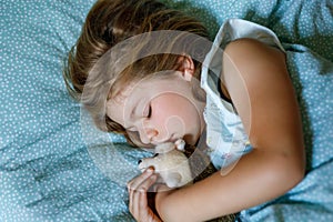 Cute Little Preschool Girl Sleeping In Bed. Adorable Preschool Child Dreaming, Healthy Sleep Of Children By Day. Deep