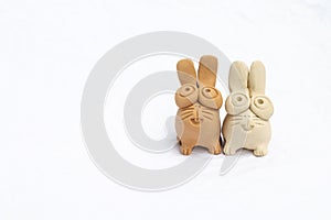 Cute little rabbit clay doll isolate on white background